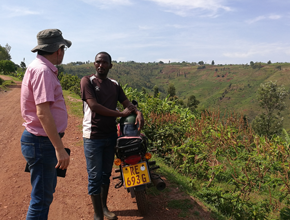 Two people discussing in the field in Rwanda